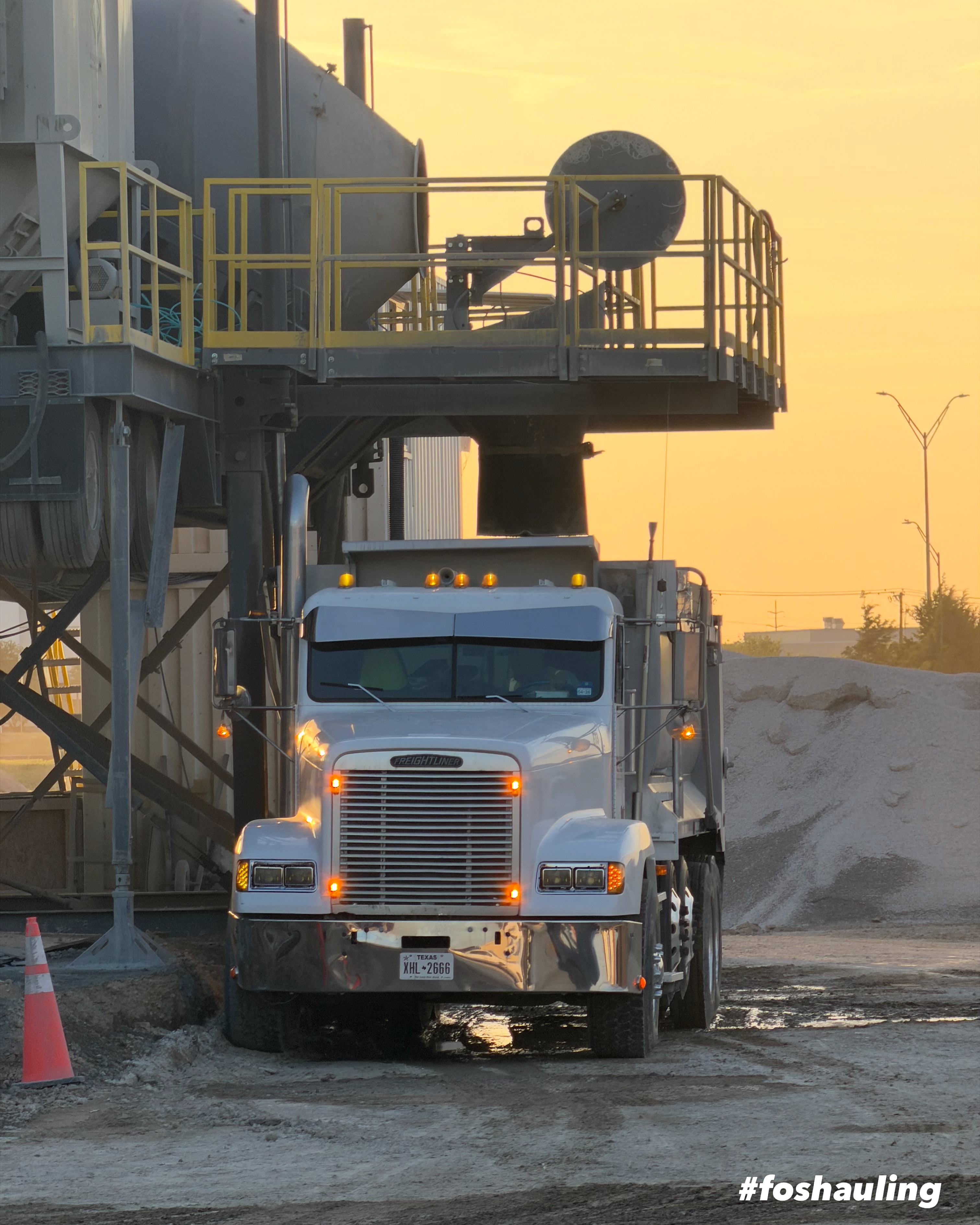 FOS Logistics truck at a construction site during golden hour