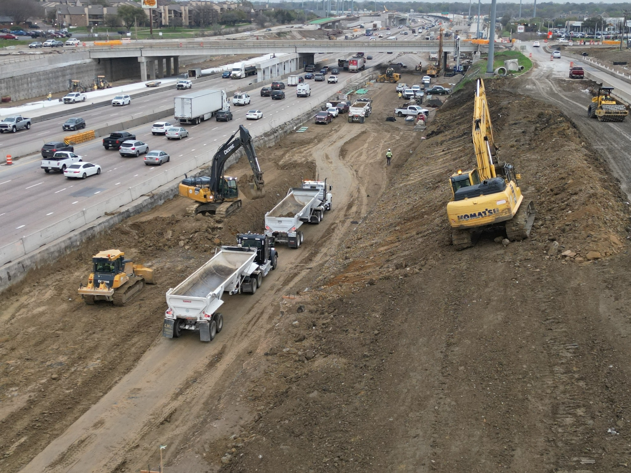 Multiple FOS Logistics trucks working together on a large construction project